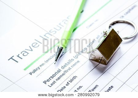 Traveling Concept With Insurance Application On White Table