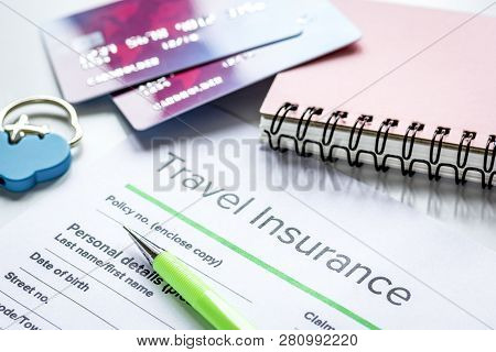 Travel Insurance Application Form On White Desk Background