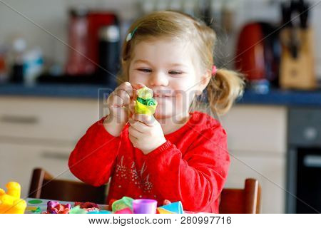 Adorable Cute Little Toddler Girl With Colorful Clay. Healthy Baby Child Playing And Creating Toys F
