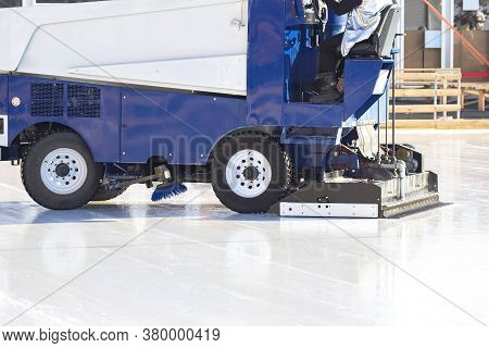 Special Machine For Cleaning Ice On An Ice Rink At Work. Transport Industry