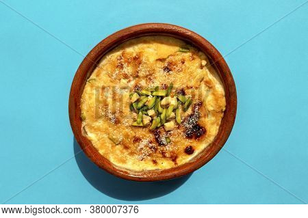 Traditional Arabic, Egyptian, Eastern Dessert Om Ali. Top View. Egyptian Bread Pudding In A Brown Bo