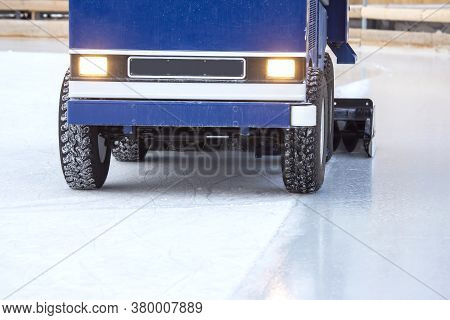 Special Machine For Cleaning Ice On An Ice Rink At Work. Transport Industry