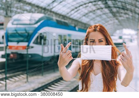 Girl Holding A Medical Mask In Her Hands