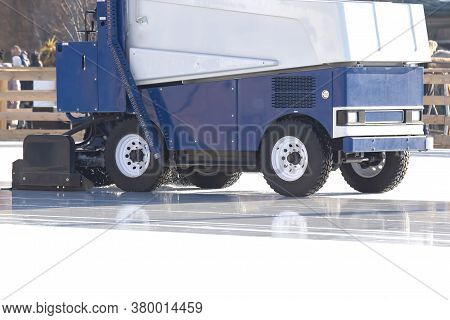 Special Machine For Cleaning Ice On An Ice Rink At Work. Transport Industry