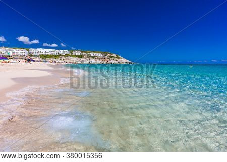 CALA MESQUIDA, MALLORCA, SPAIN - 19 July 2020: People enjoying beautiful sandy beach of on Mallorca, Mediterranean Sea, Balearic islands, Spain.