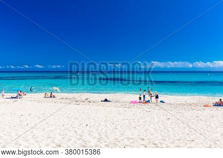 CALA MESQUIDA, MALLORCA, SPAIN - 19 July 2020: People enjoying beautiful sandy beach of on Mallorca, Mediterranean Sea, Balearic islands, Spain.