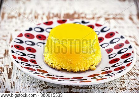 Egg Yolk Candy, Called Quindim In Brazil And Brisas Do Liz In Portugal, With Grated Coconut, Almonds