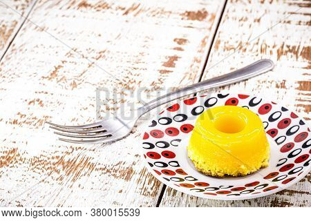 Egg Yolk Candy, Called Quindim In Brazil And Brisas Do Liz In Portugal, With Grated Coconut, Almonds