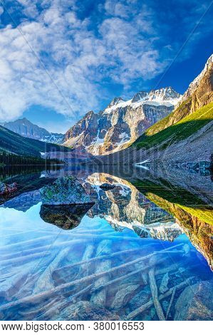 Beautiful Glacier-covered Mount Quadra Reflecting Off Consolation Lake On Moraine Lake Hike Near Lak