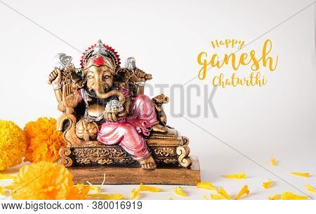 Happy Ganesh Chaturthi Festival, Bronze Ganesha Statue And Golden Texture With Flowers, Ganesh Is Hi