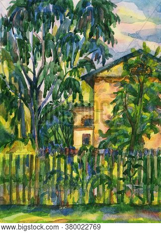 Private House With Trees In Spacious Green Territory Behind County Style Wooden Fence, Shrubs And La