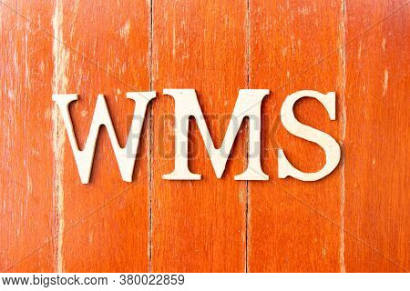 Alphabet Letter In Word Wms (abbreviation Of Warehouse Management System) On Old Red Color Wood Plat