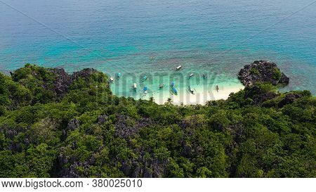Travel Concept: Tropical Sand Beach And Turquoise Water View From The Top. Lahos Island, Caramoan Is