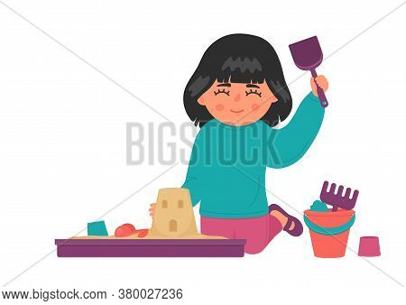 Kid Plays With Sand And Toys In Plastic Sandbox.