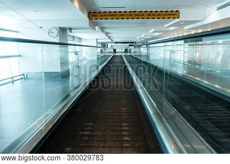 A Travelator In An Empty Airport Corridor During The Coronavirus Pandemic.