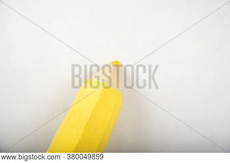 Yellow Pencil Stands On A White Background.