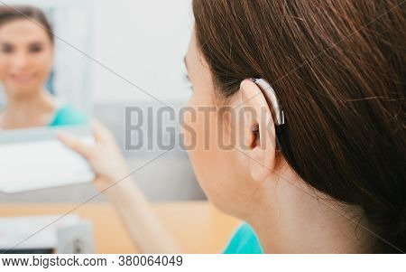 Bte Hearing Aid On Female Ear. Deafness Treatment, Hearing Solution