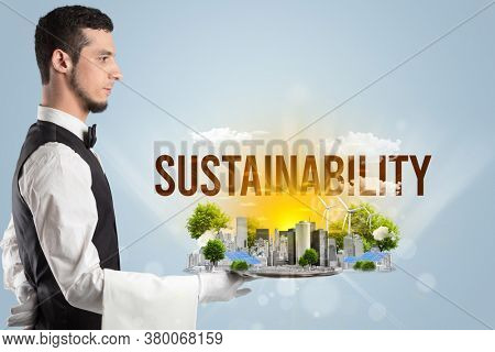 Waiter serving eco city with SUSTAINABILITY inscription, renewabke energy concept