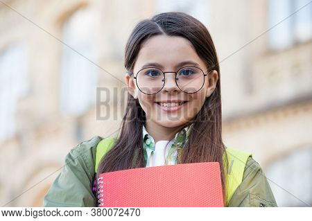 Feeling Happy About Doing Homework. Happy Child Back To School. Little Kid Hold Books. Homework Assi