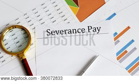 Paper With Severance Pay On A Table. Business