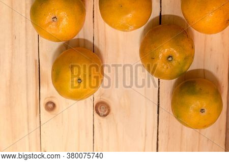 View From Above Of A Group Of Delicious Sweet Juicy Fresh Clementines Rich In Vitamin C On A Rustic 