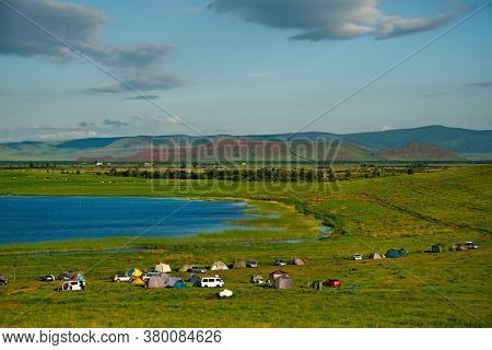 Russia. Republic Of Khakasia. Steppe Salt Dough Of The Lake, Among The Picturesque Rolling Mountains