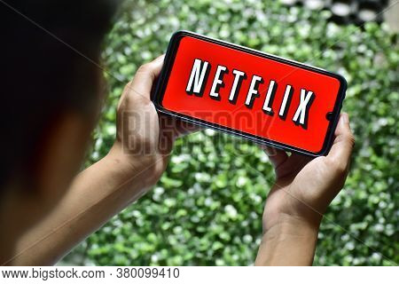 New Delhi, India, September 13 2019: Woman Hand Holding Smart Phone With Netflix Logo Netflix Is A G