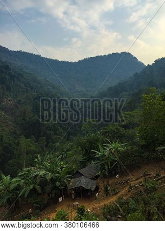 Mountains Full Of Vegetation, Trees, And Little Indigenous Houses In The Ciudad Perdida (lost City) 