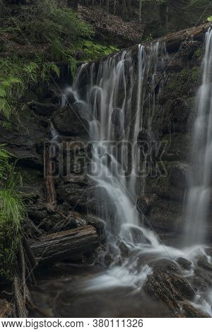 Waterfall On Divoky Creek Near Kouty Nad Desnou Village In Summer Day