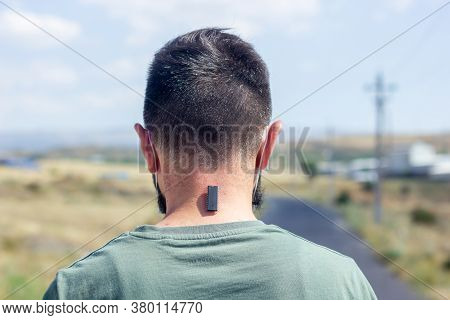 5g Chip On The Neck Of A Young Man