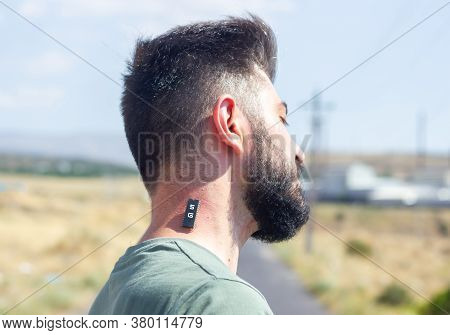 5g Chip On The Neck Of A Young Man