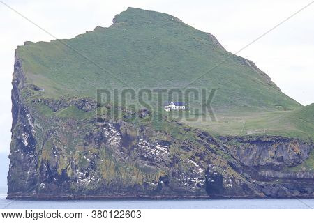 Lonely House On The Island Of The Vestmannaeyjar Archipelago. Iceland