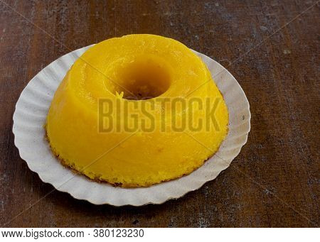 Closeup On Quindim, A Tasty Yellow Brazilian Dessert Made With Condensed Milk And Eggs On Grunge Woo