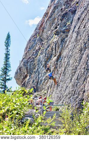 Canmore, Canada - July 28, 2020: Rock Climbers Scale The Steep, Pocketed Crags At Grassi Lakes In Ca