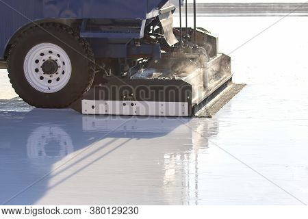 Special Machine For Cleaning Ice On An Ice Rink At Work. Transport Industry