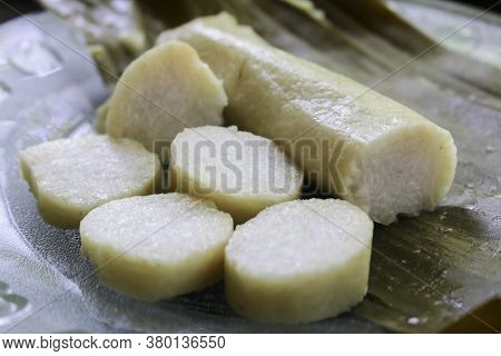 Close Up Photo Of Rice Cake Or Commonly Called Lontong, Traditional Food Wrapped In Banana Leaf From