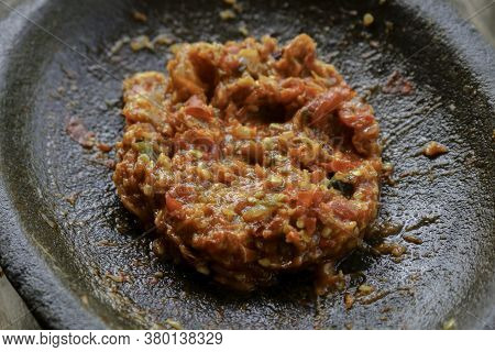 Fresh Sambal Served On Stone Mortar (cobek). Sambal Is Traditional Sauce From Indonesia Made From Ch