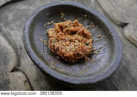 Fresh Sambal Served On Stone Mortar (cobek). Sambal Is Traditional Sauce From Indonesia Made From Ch