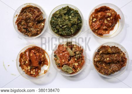Aneka Sambal Indonesia. Five Kinds Of Indonesian Spicy Condiments Plated In Saucers Of Mini Bowl. A 