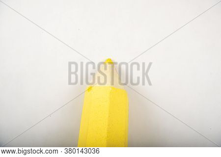 Yellow Pencil Stands On A White Background.