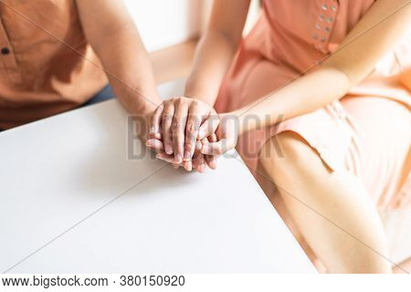 Woman Holding Hands To Elderly With Alzheimer Disease At Home,adult Social Care Concept