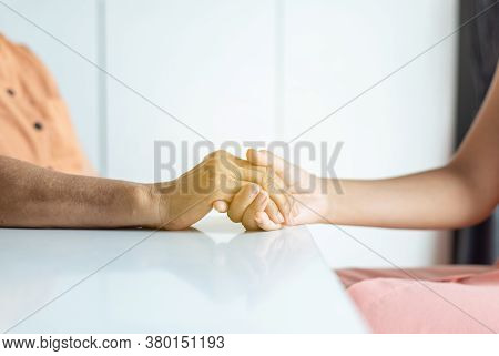 Woman Holding Hands To Elderly With Alzheimer Disease At Home,adult Social Care Concept