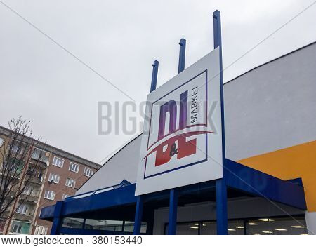 Karvina, Czechia - December 23, 2019: Logo Of A Newly Opened D&l Market Supermarket Above The Entran