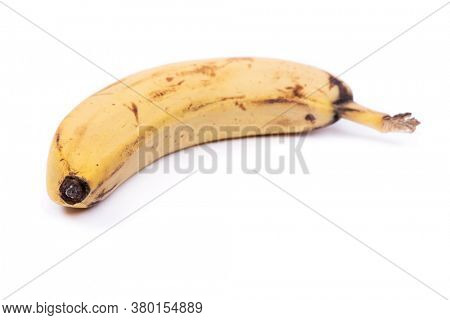 Ripe yellow banana fruit, one overripe banana with dark spots isolated on white background