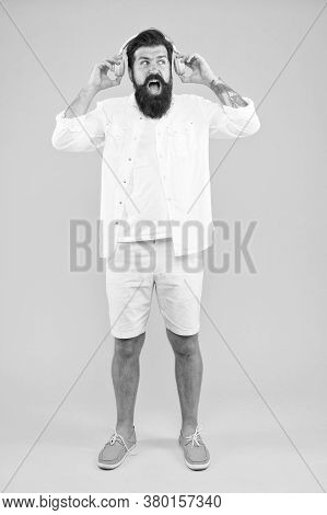 Its Too Loud. Shouting Bearded Man In Headphones Listening To Music. Mature Hipster With Beard. Dj I