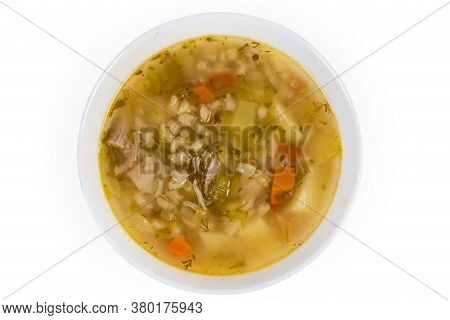 Rassolnik - Meat Soup With Pearl Barley And Pickled Cucumbers In The Bowl, Top View On A White Backg