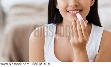 Cropped Of Asian Woman Using Lipbalm, Bedroom Interior, Panorama With Empty Space
