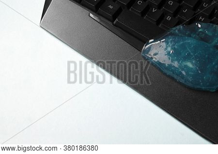 Blue Soft Gel Cleaning Dust On Keyboard. Concept Cleaning Your Computers Keyboard. Office Cleaning.