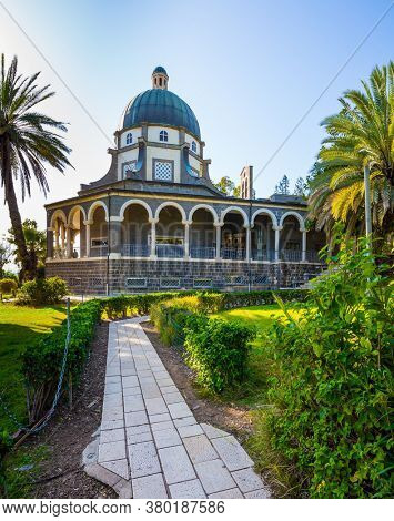 The Catholic Church of the Beatitudes of the Italian female Franciscan monastery on Mount Bliss. The Sea of Galilee. Israel. Blooming huge park around the monastery. 