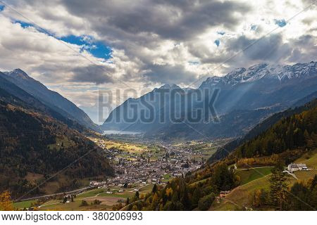 Stunning Aerial Panorama View Of Poschiavo Town In Valley With Swiss Alps And Lago Di Poschiavo Lake